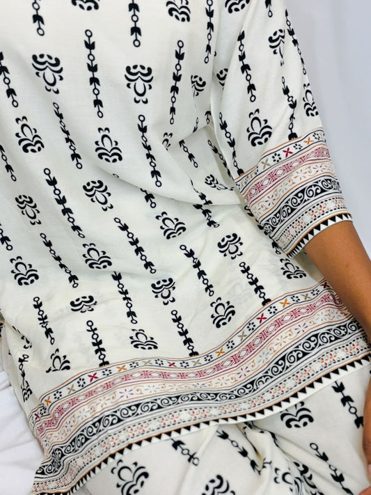White fabric with black and multicolor patterns